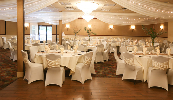 Wedding reception area with greenery on all tables