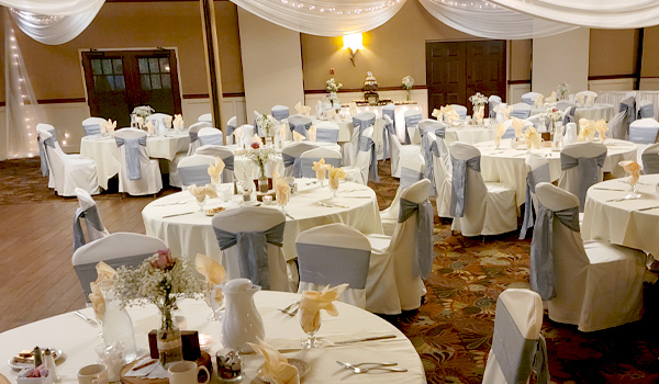 Wedding reception area with green table cloths