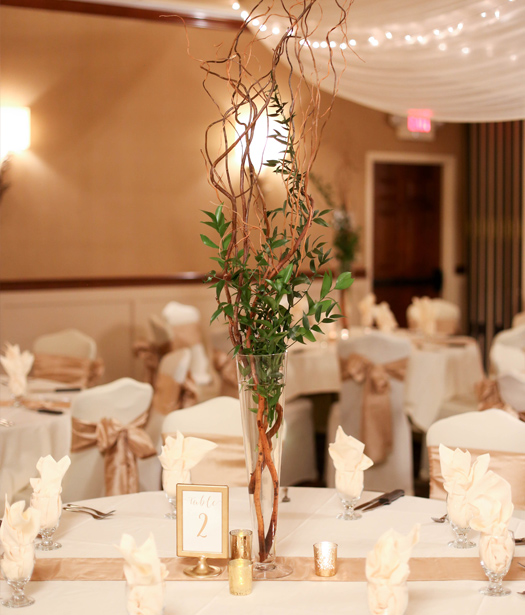 Wedding reception area with greenery on table